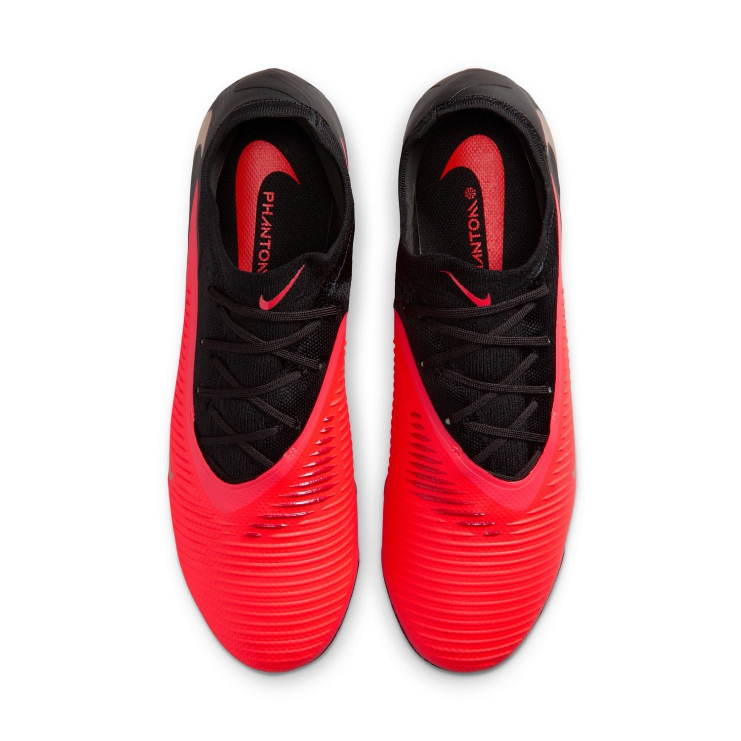 Nike Phantom 6 Low Pro FG red and black firm-ground soccer cleats with VNMSkin upper and Cyclone 360 traction plate.