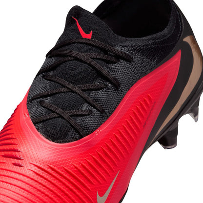 Nike Phantom 6 Low Pro FG red and black firm-ground soccer cleats with VNMSkin upper and Cyclone 360 traction plate.