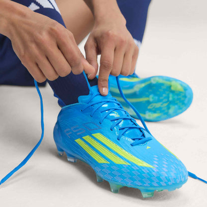adidas F50 Elite FG blue yellow being laced before play