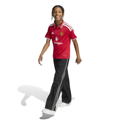 Kid wearing Manchester United 26/27 Home Jersey Youth side view