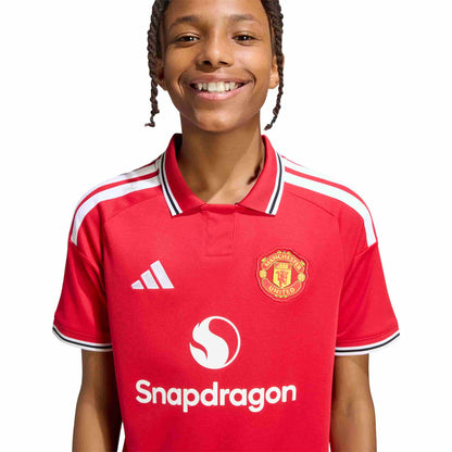 Kid wearing Manchester United 26/27 Home Jersey Youth front view